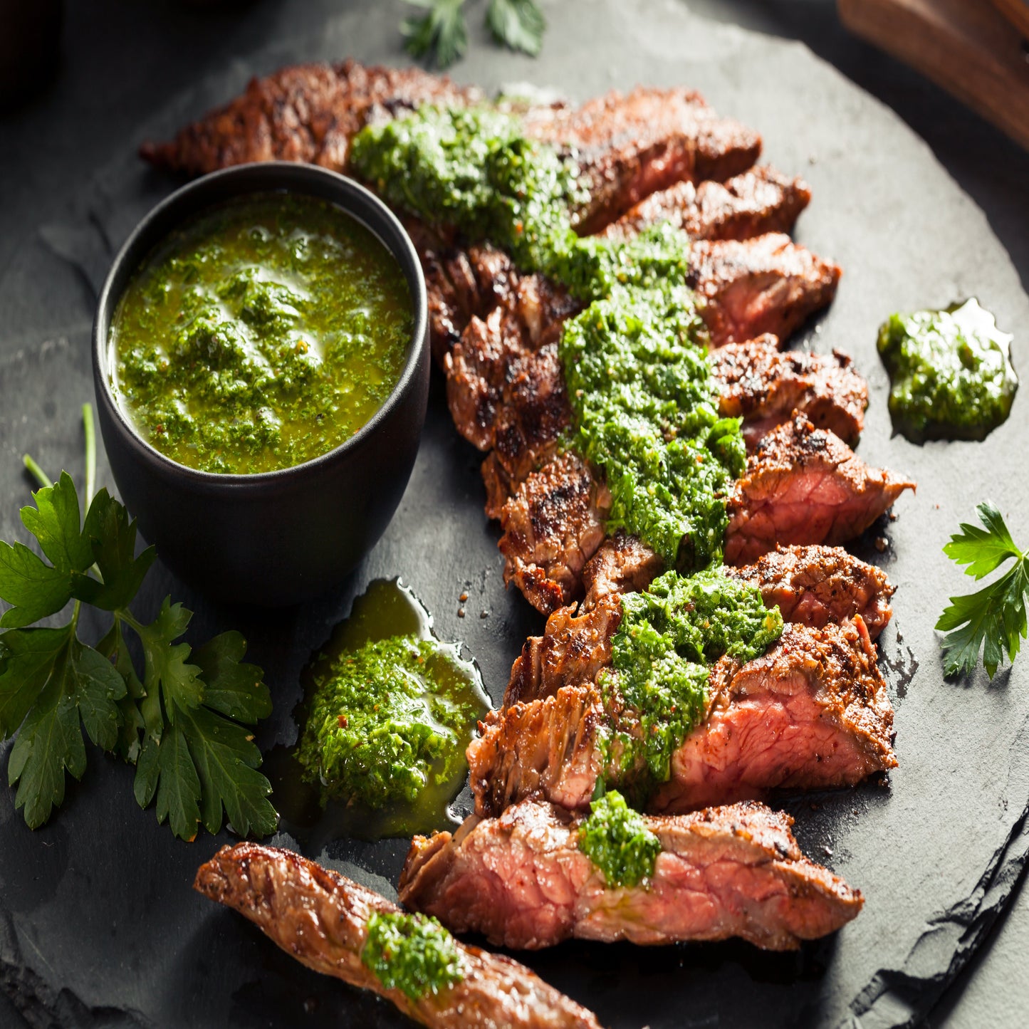 Grilled Skirt Steak sliced with chimichurri from Diamond B Ranch