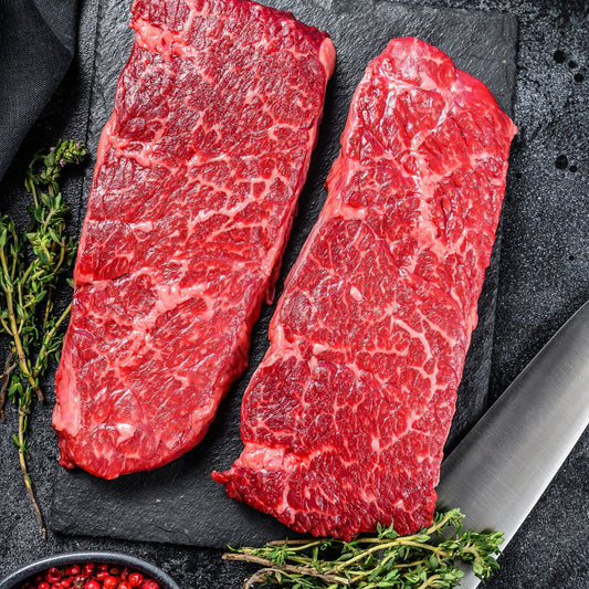 Raw pasture-raised Angus Denver steaks from Diamond B Ranch